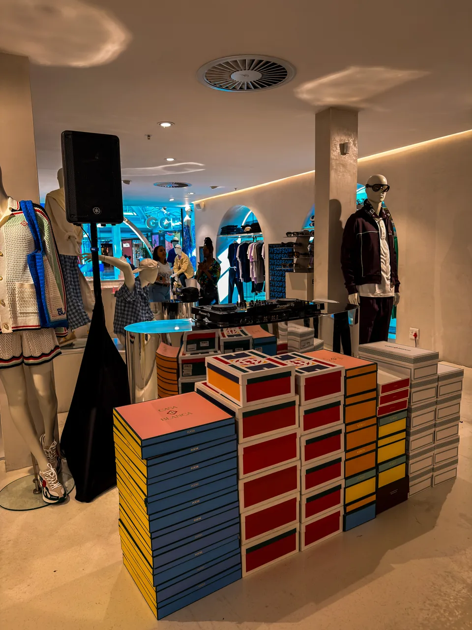 Speaker and DJ booth set up inside a retail venue